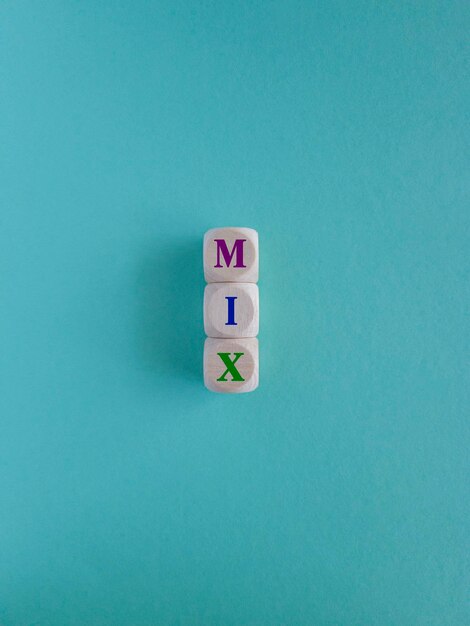 Marketing mix symbol Text MIX on wooden cubes Beautiful blue background