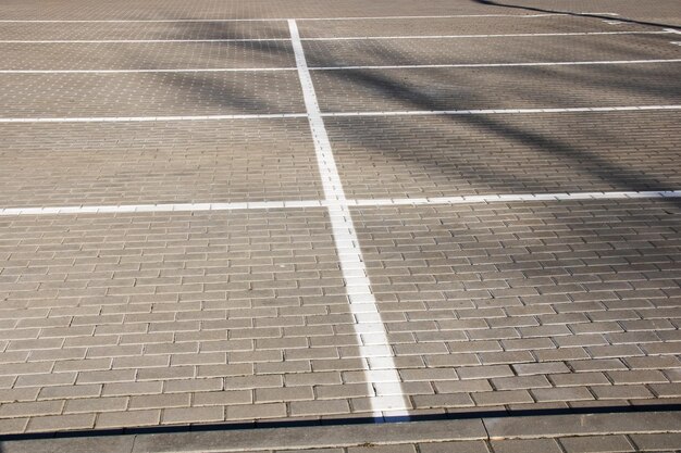 Markings in an empty parking lot for cars