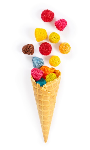 Marmalade candy in the form of berries in waffle cone isolated on white background