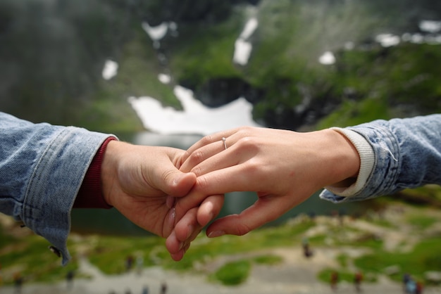 marriage proposal in the mountains close up