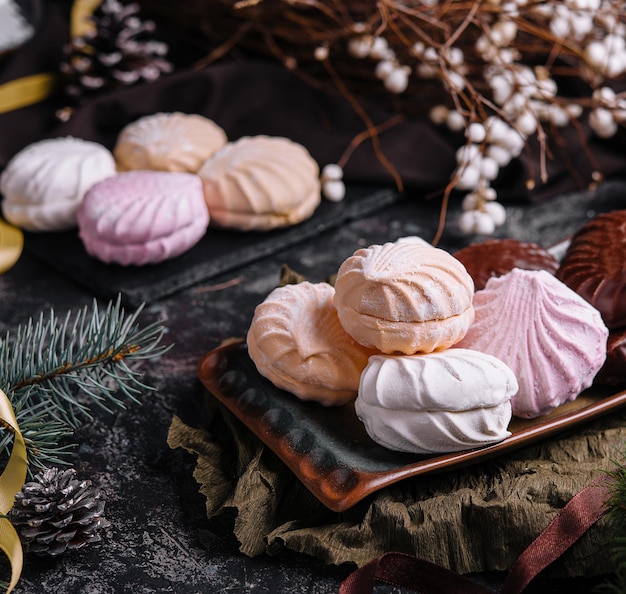 Marshmallow cakes in chocolate glaze and christmas decor