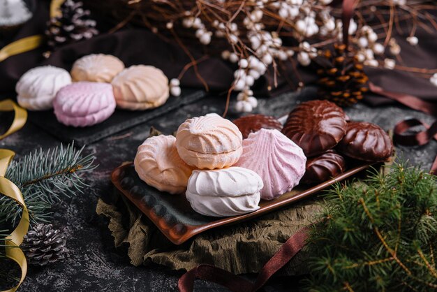 Marshmallow cakes in chocolate glaze and christmas decor