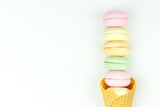 Marshmallow looks like macaroons in the horn as ice cream on white background