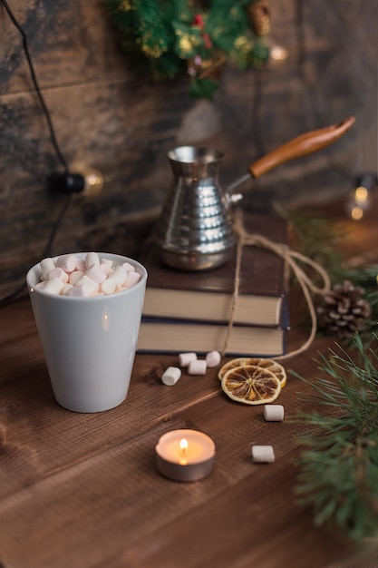 Marshmallows in a cup of cofee with turka in Christmas decorations