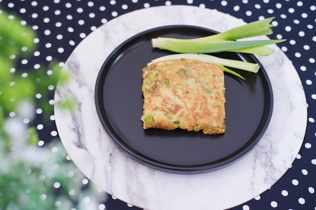 Photo martabak telor or martabak telur savory panfried pastry stuffed with egg meat and spices