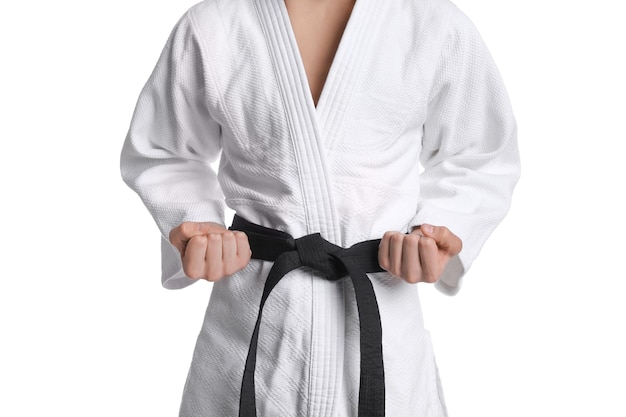 Martial arts master in keikogi with black belt on white background closeup