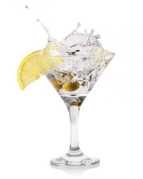 Martini splash with drops and olives in a transparent glass