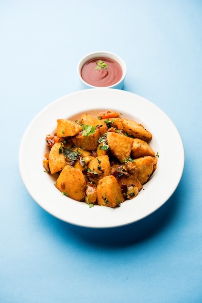 Masala fried Idlies - south indian Snack made using with leftover idly served with tomato ketchup. selective focus