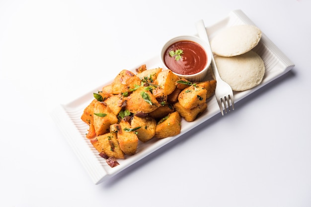 Masala fried Idlies - south indian Snack made using with leftover idly served with tomato ketchup. selective focus