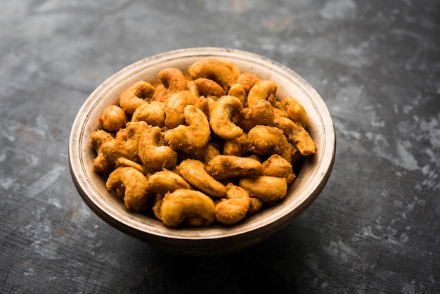 Masala Kaju or spicy Cashew in a bowl. Popular festival snack from India, asia, also known as Chakna recipe