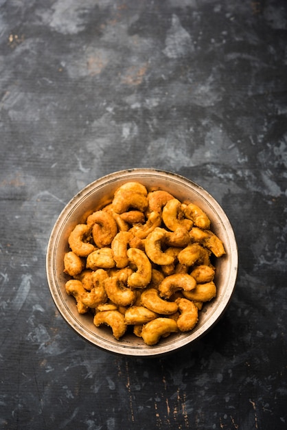 Masala Kaju or spicy Cashew in a bowl. Popular festival snack from India, asia, also known as Chakna recipe