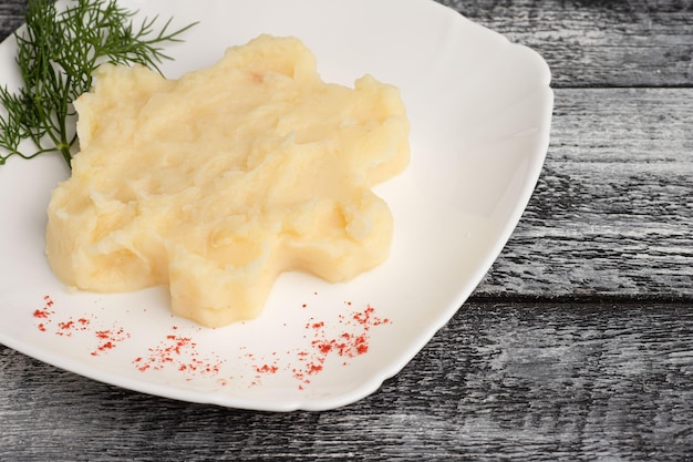 Mashed potatoes mashed potatoes on a wooden white background