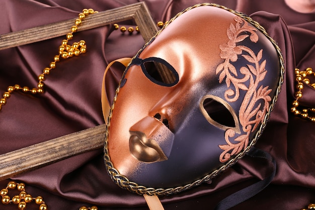 Mask on brown fabric