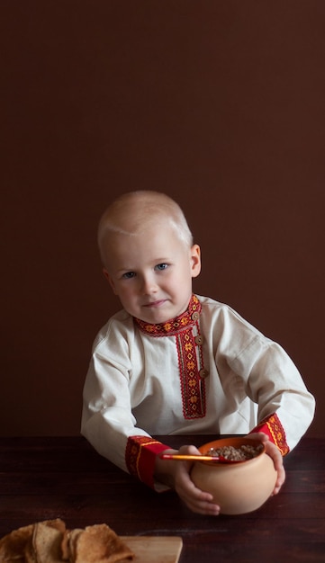 Maslenitsa concept Russian boy Traditional russian style