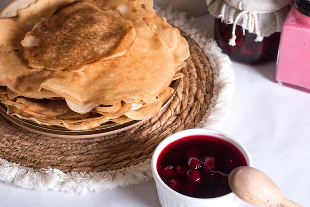 Maslenitsa holiday pancakes with jam on the table The Russian tradition