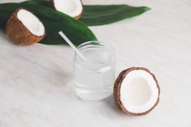 Mason jar of fresh coconut water on table