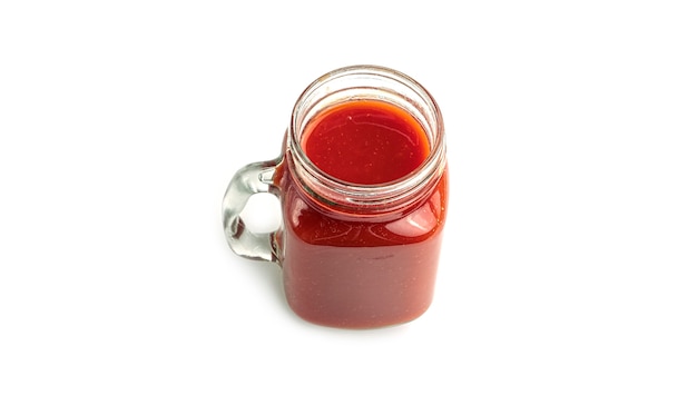 Mason jar with tomato juice .