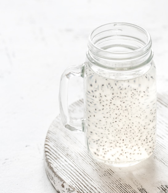 A masonn jar with basil seed drink