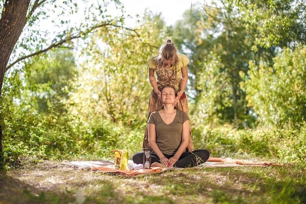 Massage professional impliments her massage abilities in nature