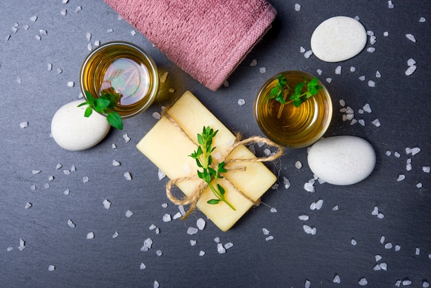 Massage set with oil, stones, soap, salt and towel