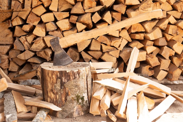 massive axe stuck in a beech stub with wood blocks as background