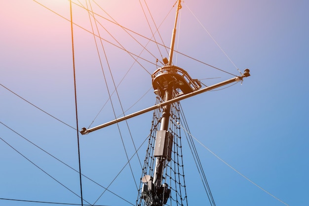 Mast of ship in harbor