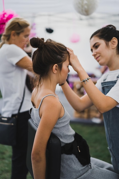 master class make-up. girl makes make-up to her friend