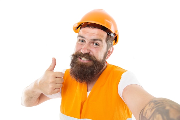 Master committed to superior quality and results. Master builder give thumbs up hand. Bearded man master happy smiling isolated on white. Worker in protective helmet and safety vest. Master of craft.