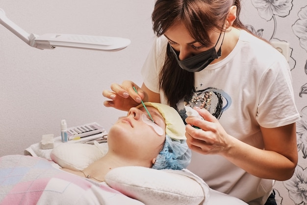 master eyelash extension at work, apply glue, home workplace