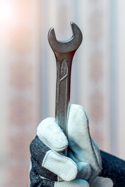 Master mechanic holding a wrench Wrench in the hand of a repairman