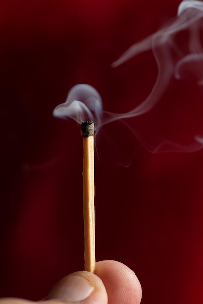 Match, hands holding a matchstick, Selective focus.