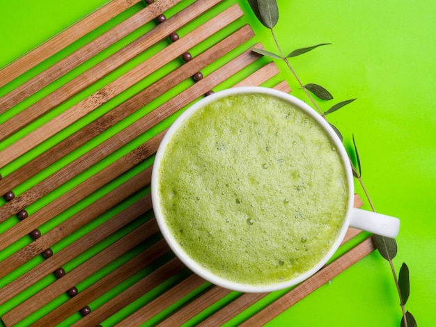 Matcha green tea latte in a cup Top view