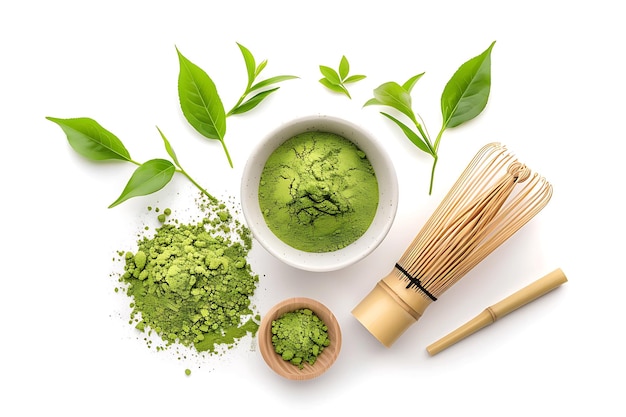 Matcha Green Tea Powder with Bamboo Whisk and Tea Leaves on White Background