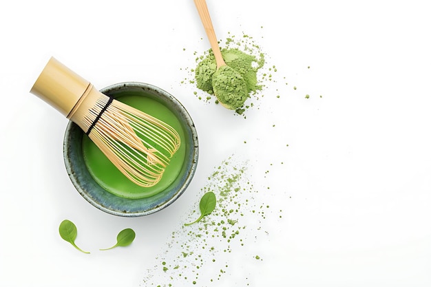 Matcha Green Tea Powder with Whisk and Leaves on White Background