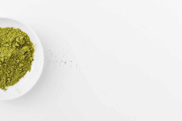 Matcha powder in a bowl with copy space