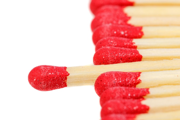 Matches with a red head on a white background