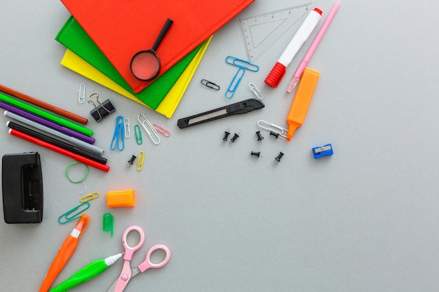 Material for school, paper clips, pencils, colors, scisor and notebook