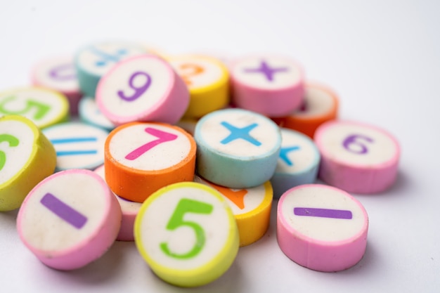 Photo math number colorful on white table, education study mathematics learning teach concept.