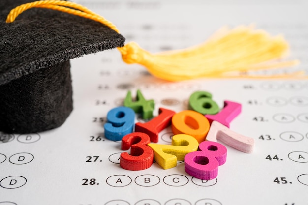 Math Number colorful with graduation hat and pencil on Answer sheet background Education study mathematics learning teach concept