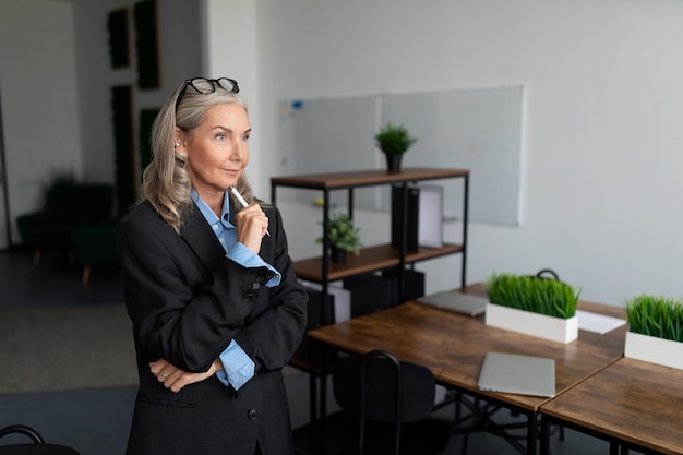 Mature adult woman head with gray hair in the office