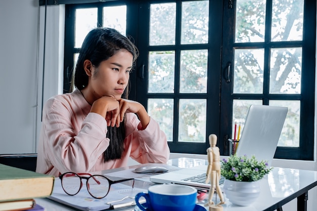 Mature business woman working with laptop in office.