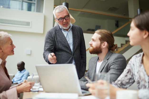 Mature Businessman Leading Meeting