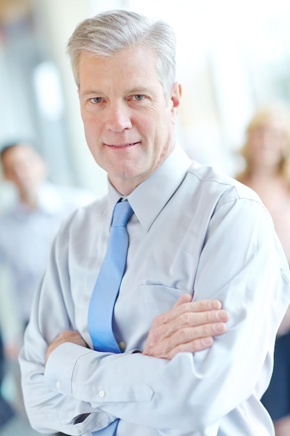 Photo mature businessman portrait and arms crossed in office leader and confidence in team solidarity male person collaboration and group for professional unity support and manager in accounting firm