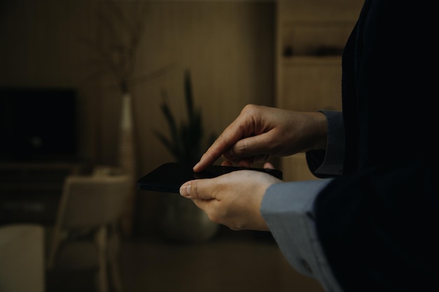 Mature businessman using a digital tablet to discuss information with a younger colleague