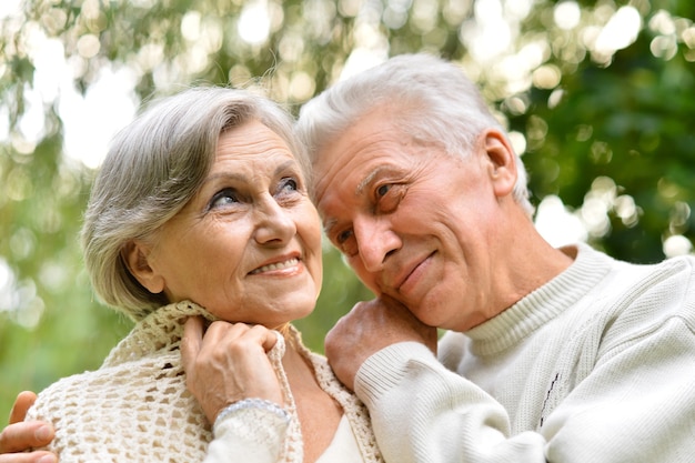 Mature couple walking in the autumn park