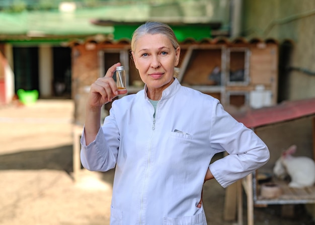 Mature female veterinarian on a farm