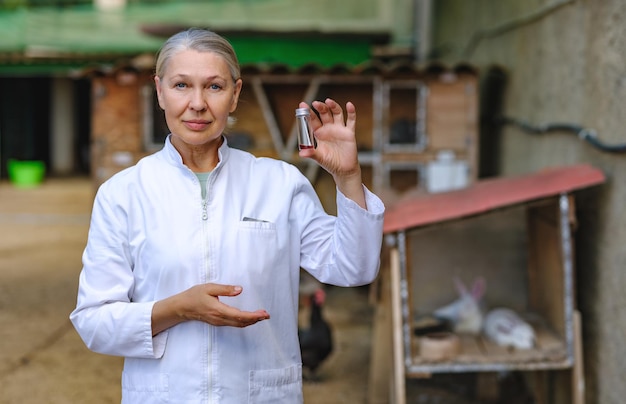 Mature female veterinarian on a farm