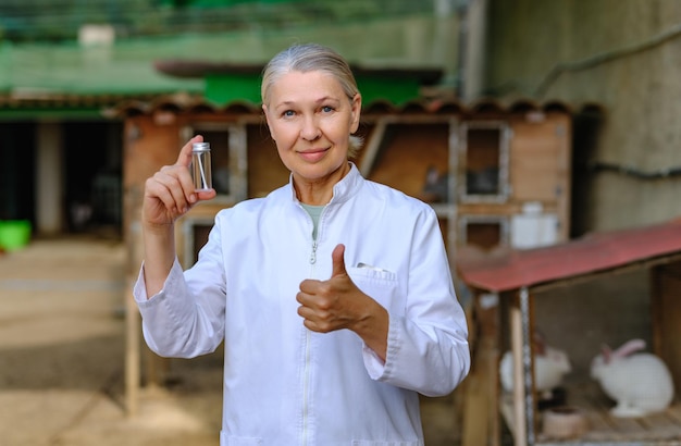 Mature female veterinarian on a farm