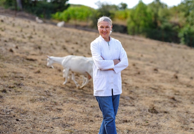 Mature female veterinarian on a farm