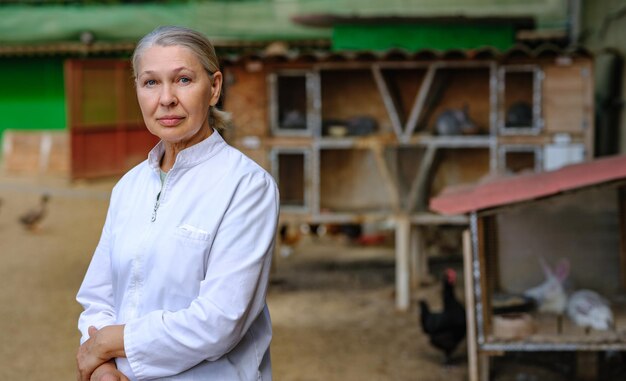 Mature female veterinarian on a farm